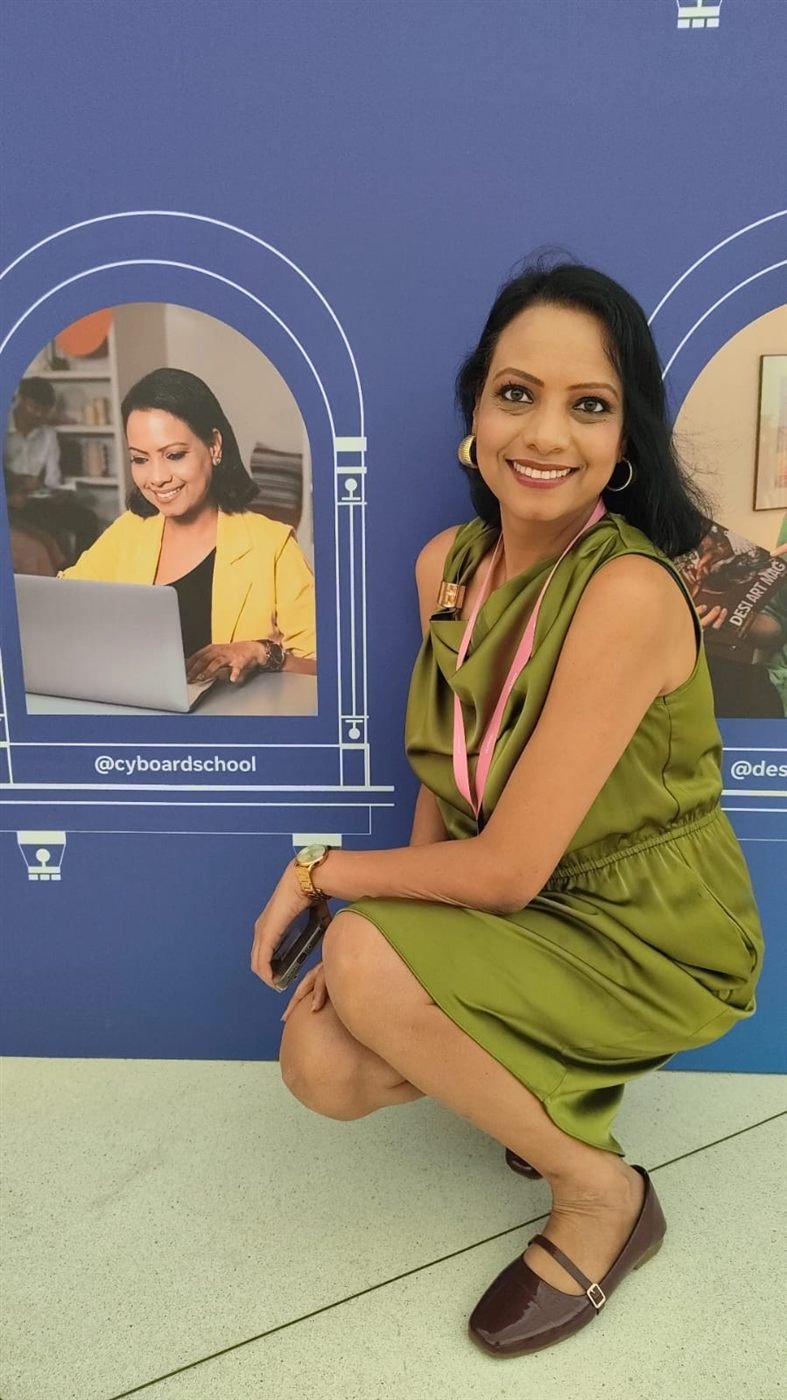 Vijayshree Kalani beside the Cyboard School feature on Meta's wall