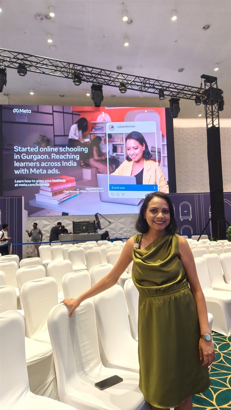 Vijayshree Kalani in front of her Meta feature on the summit screen